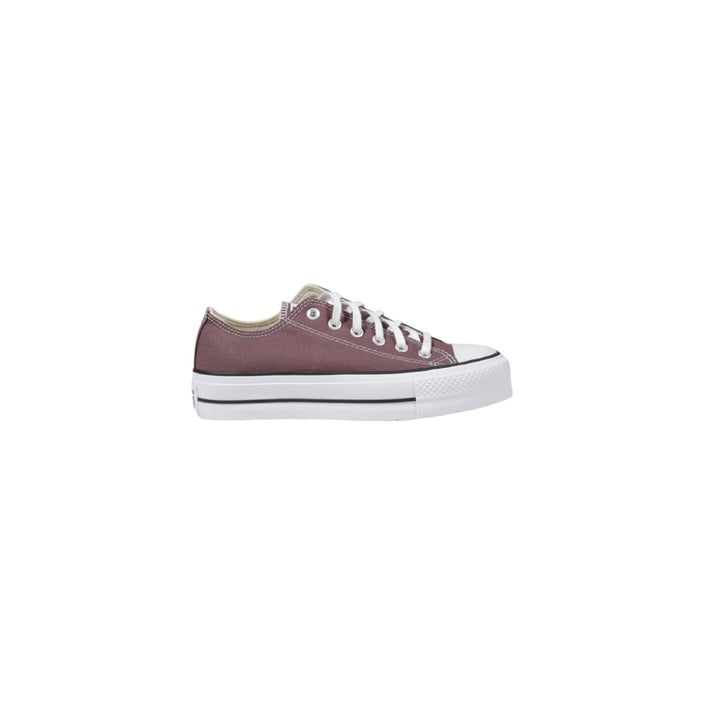 "Sneakers Converse da donna in tela, stile Chuck Taylor, con suola in gomma bianca e punta rinforzata. Scarpe casual iconiche per look sportivi e quotidiani."