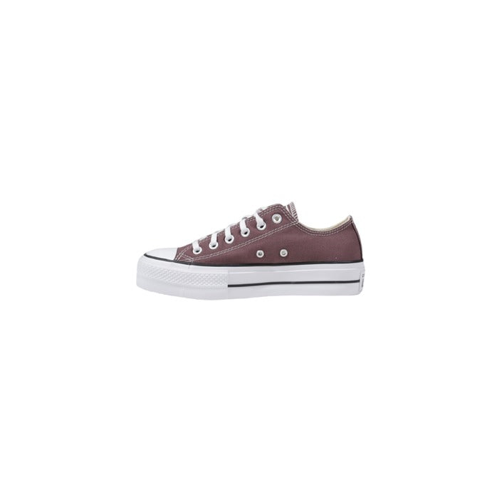 "Sneakers Converse da donna in tela, stile Chuck Taylor, con suola in gomma bianca e punta rinforzata. Scarpe casual iconiche per look sportivi e quotidiani."