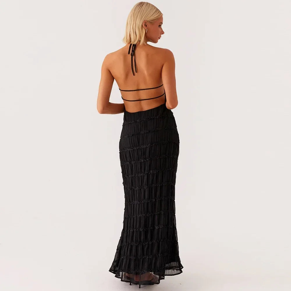 abito lungo donna con schiena scoperta e pieghe elegante