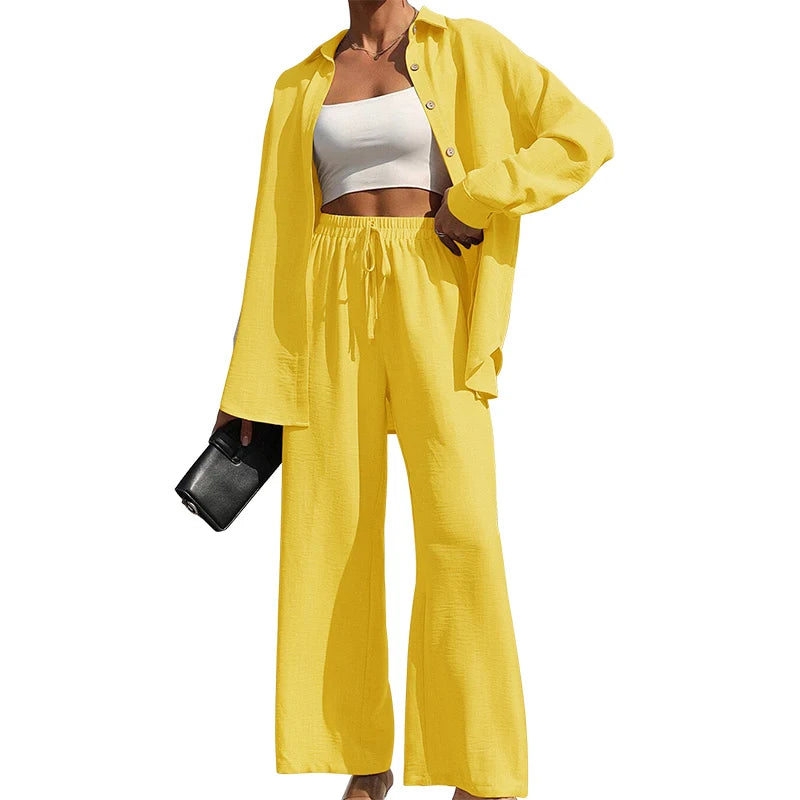 Set donna primavera–estate 2025 – camicia con bottoni e pantaloni wide-leg a vita alta