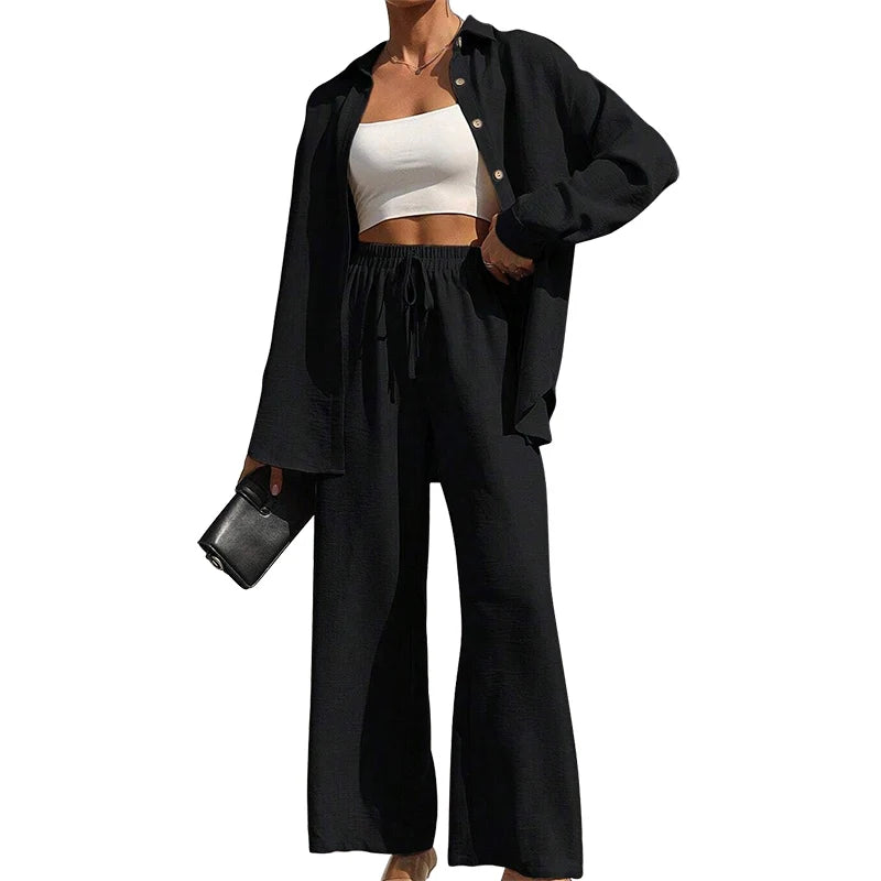 Set donna primavera–estate 2025 – camicia con bottoni e pantaloni wide-leg a vita alta