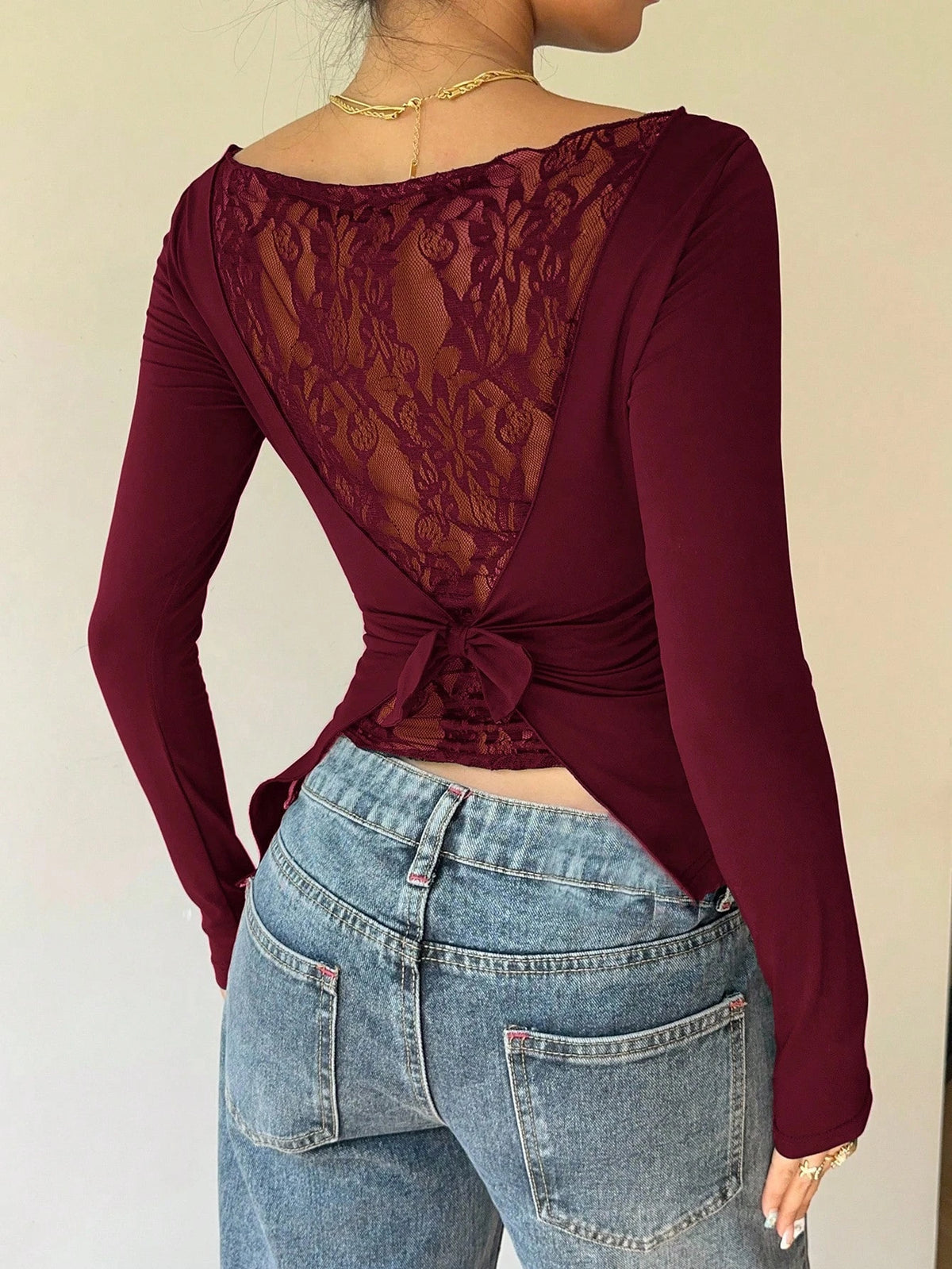 Maglia donna con pizzo e fiocco a maniche lunghe