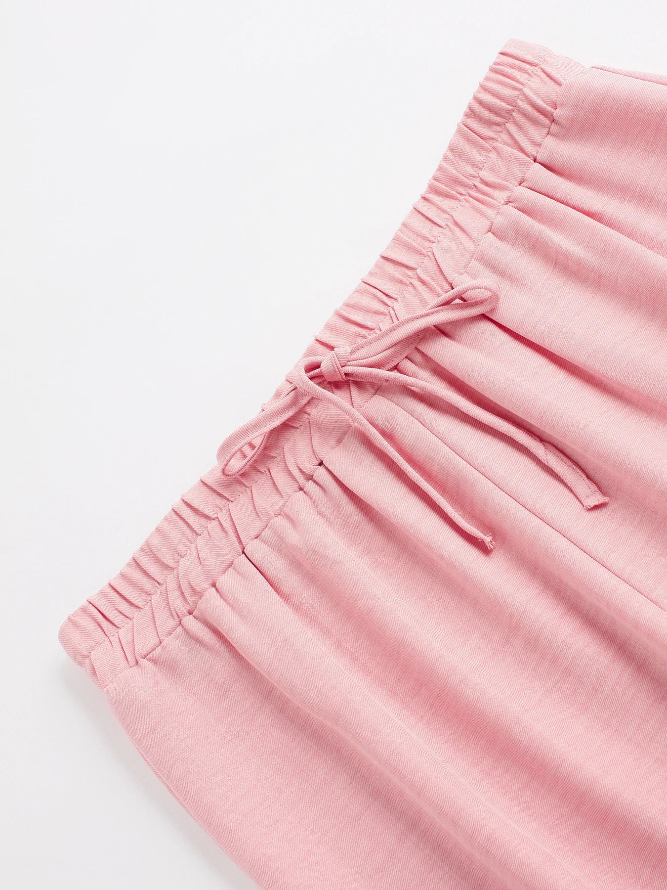 Set donna primavera–estate 2025 – camicia con bottoni e pantaloni wide-leg a vita alta