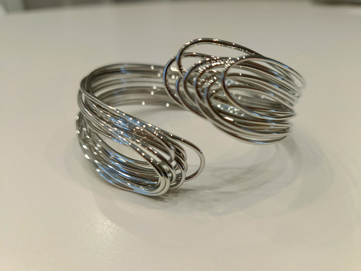 Bracciale rigido in acciaio in filo intrecciato