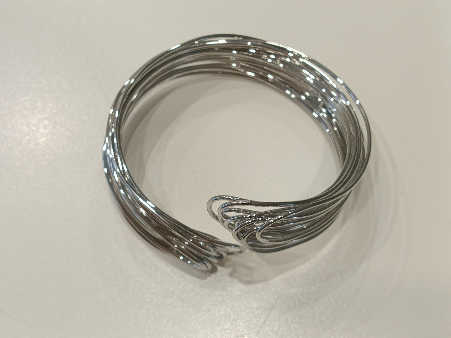 Bracciale rigido in acciaio in filo intrecciato