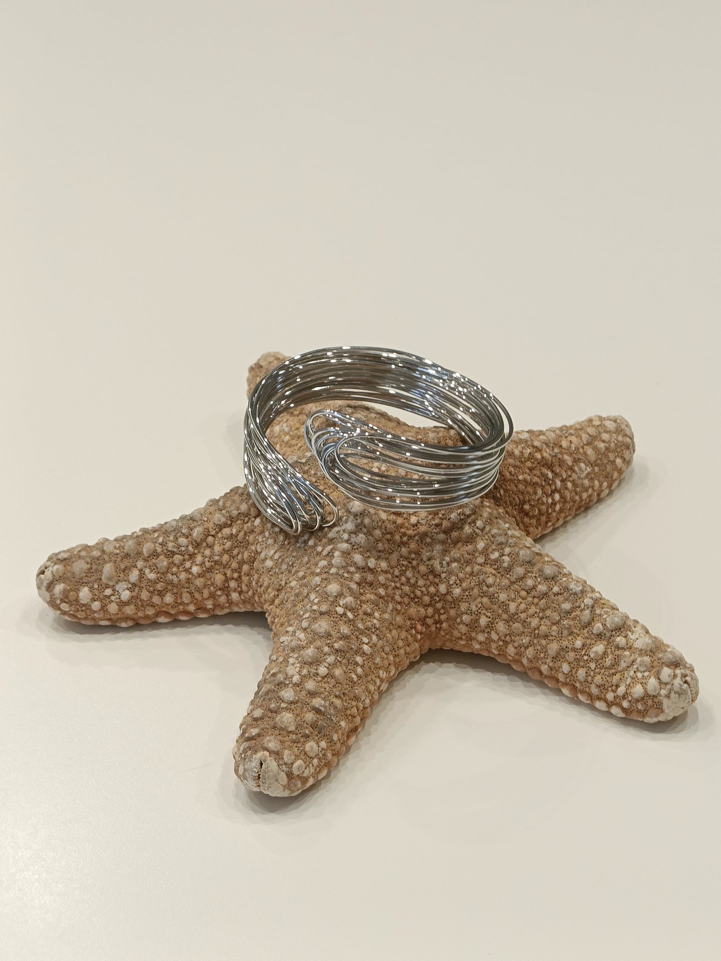 Bracciale rigido in acciaio in filo intrecciato