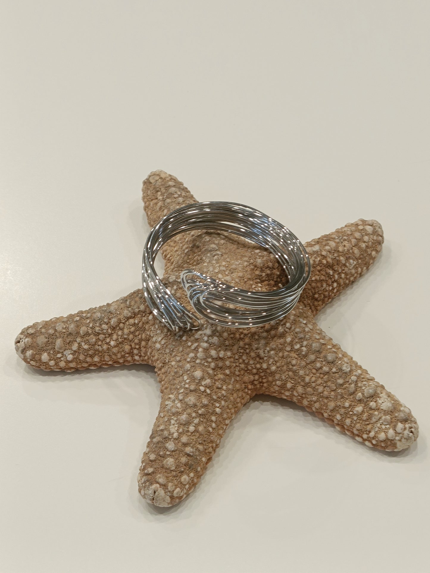 Bracciale rigido in acciaio in filo intrecciato