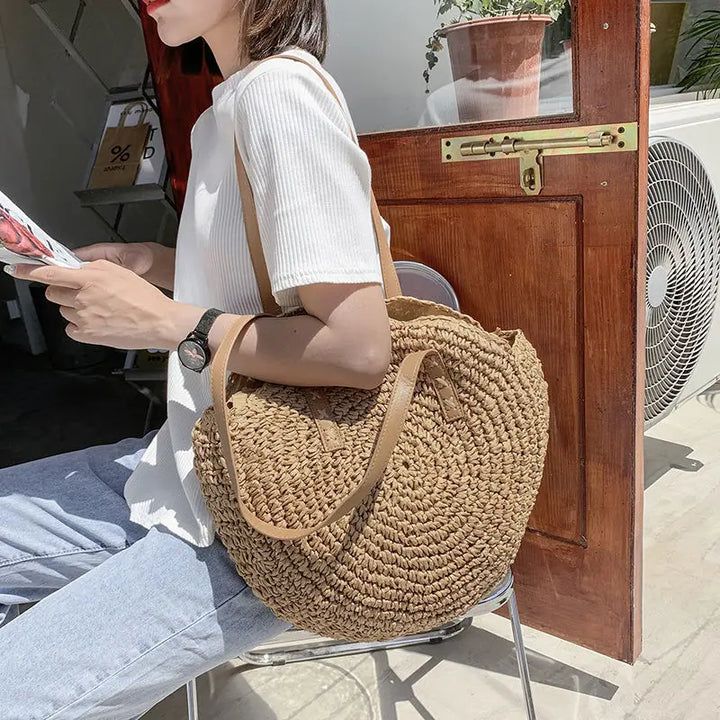 Borsa rotonda estiva in paglia intrecciata stile bohemien per donna