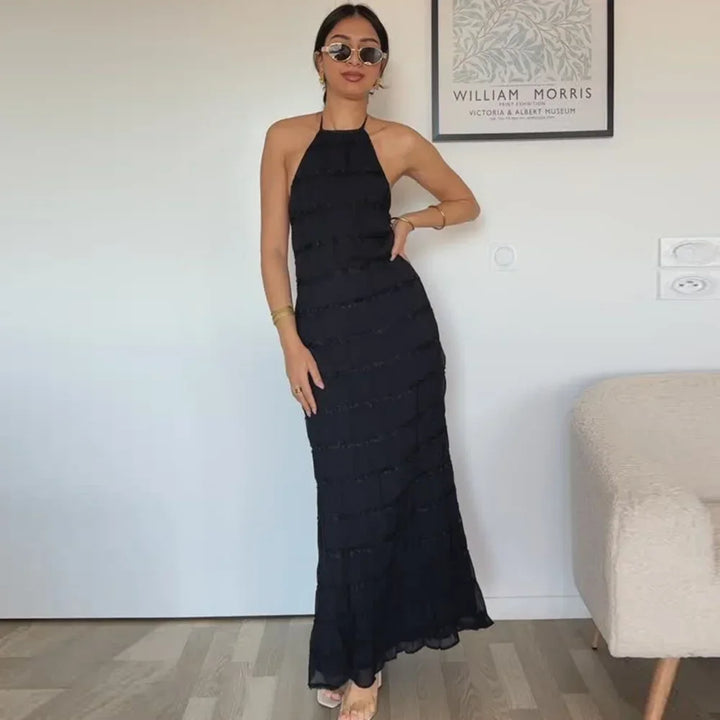 abito lungo donna con schiena scoperta e pieghe elegante