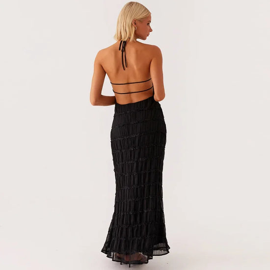 abito lungo donna con schiena scoperta e pieghe elegante