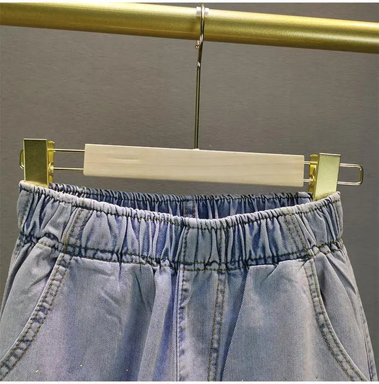 Jeans Donna Vita Alta con Gamba Larga e Vita Elasticizzata –Estate 2025
