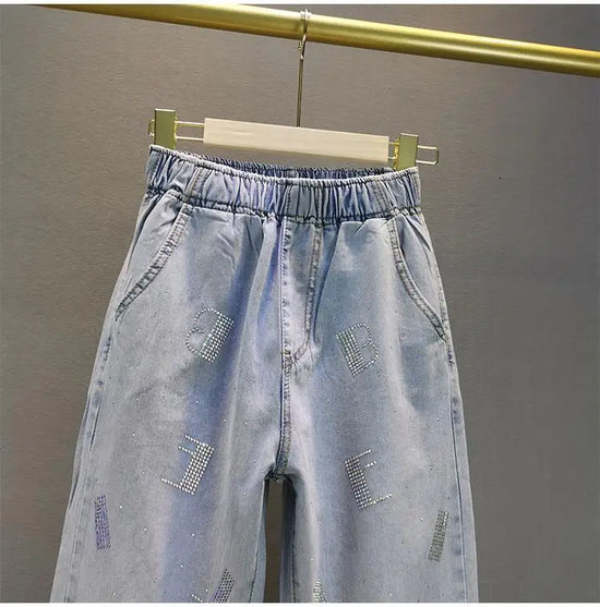 Jeans Donna Vita Alta con Gamba Larga e Vita Elasticizzata –Estate 2025