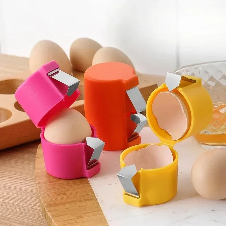 Set di apri-uova colorati giallo, arancio e fucsia con lame in acciaio per rompere il guscio in modo pulito